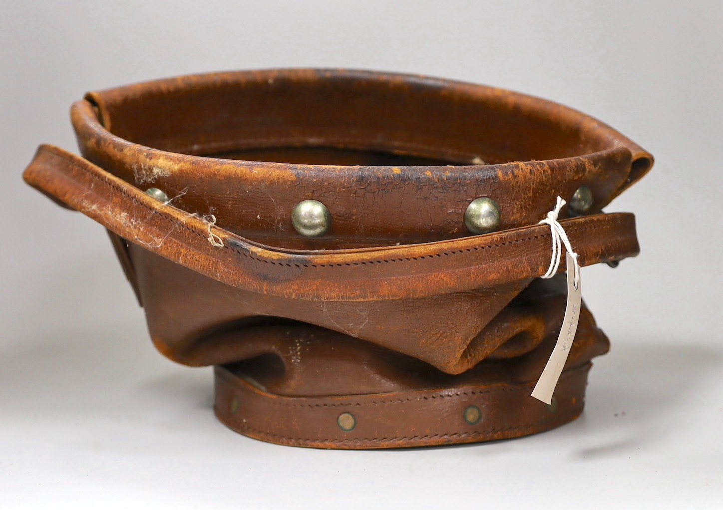 An early 20th century leather fire bucket cover